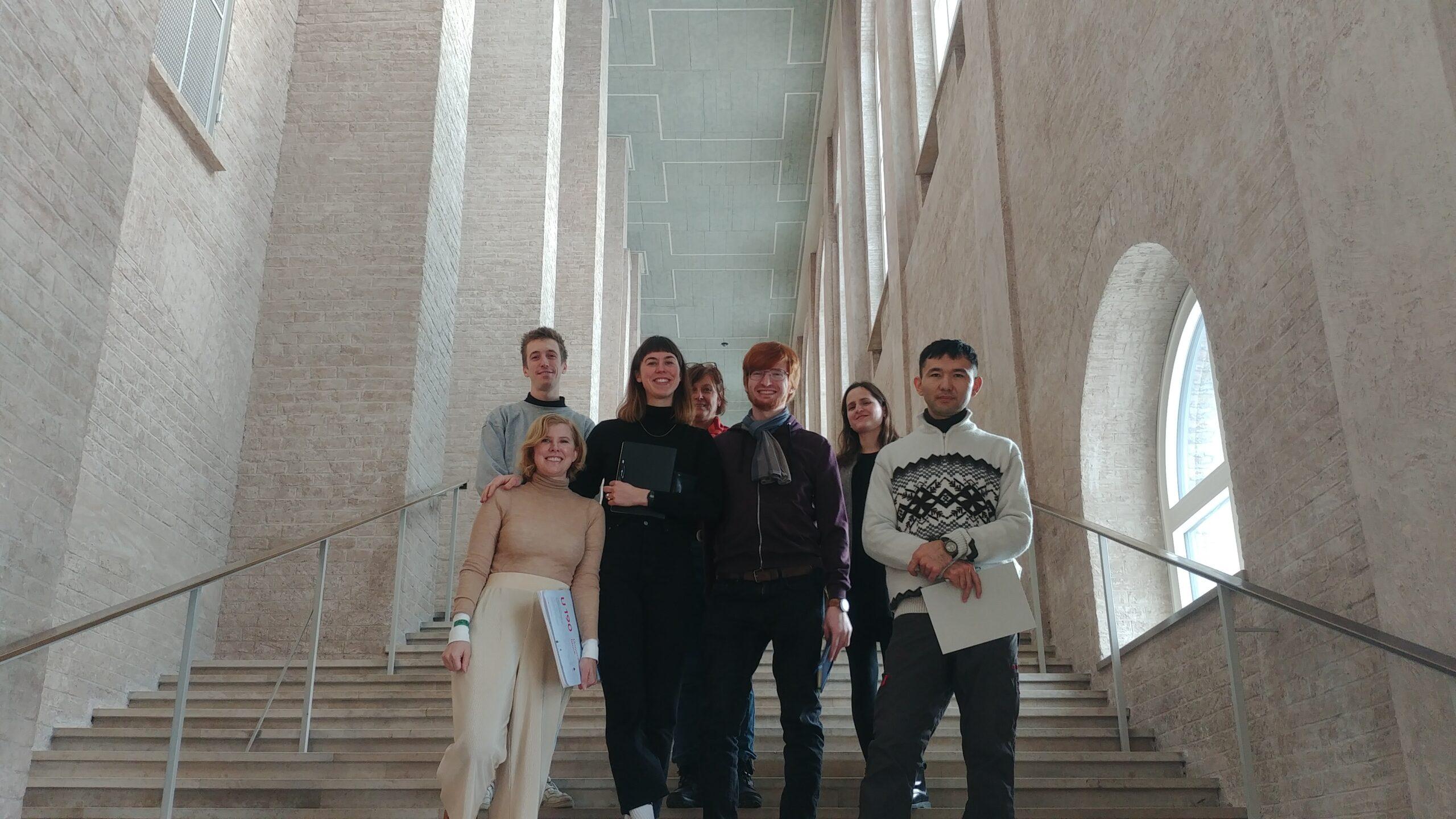 The guided group standing on stairs at the Alte Pinakothek